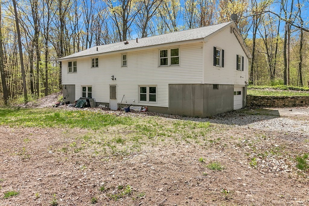 34 1/2 Paradise Lake Road Monson, MA 01057 - Photo 7 of 30 a view of a house with backyard and trees