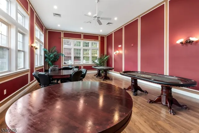 a very nice looking room with a large window and furniture