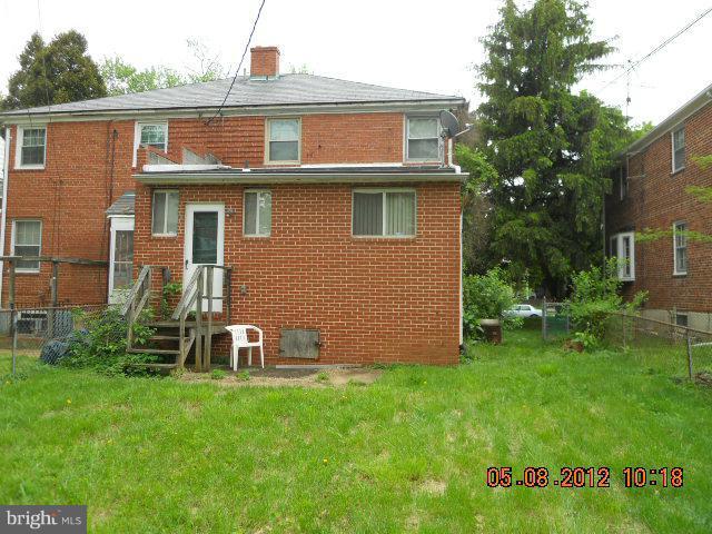 3922 Clarinth Road Baltimore, MD 21215 - Photo 3 of 10 a front view of a house with a yard
