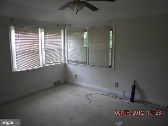 3922 Clarinth Road Baltimore, MD 21215 - Photo 10 of 10 an empty room with windows