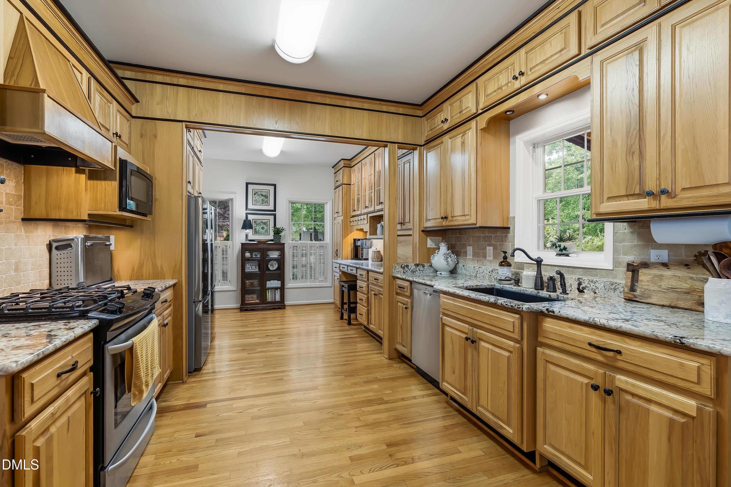 1214 Halcyon Place Rougemont, NC 27572 - Photo 24 of 69 a kitchen with stainless steel appliances granite countertop a stove a sink dishwasher and a refrigerator