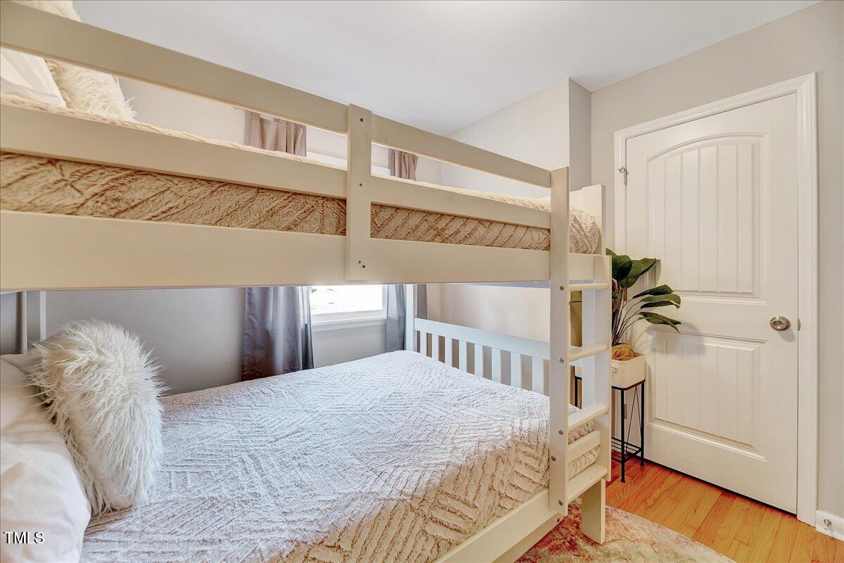 2809 Newark Drive Raleigh, NC 27610 - Photo 14 of 36 a bedroom with a bed and a window