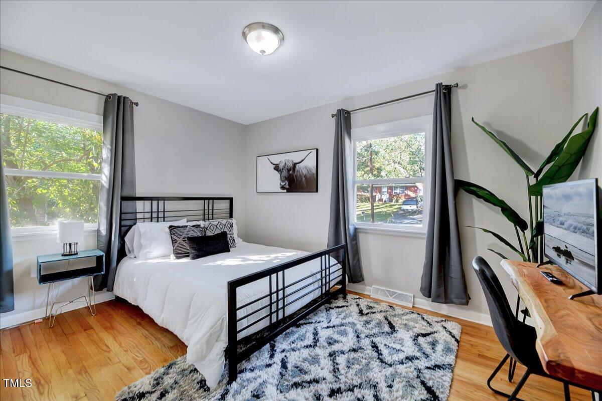 2809 Newark Drive Raleigh, NC 27610 - Photo 16 of 36 a bedroom with a bed and a window