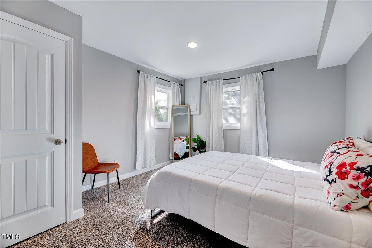 2809 Newark Drive Raleigh, NC 27610 - Photo 26 of 36 a bedroom with a bed and a window