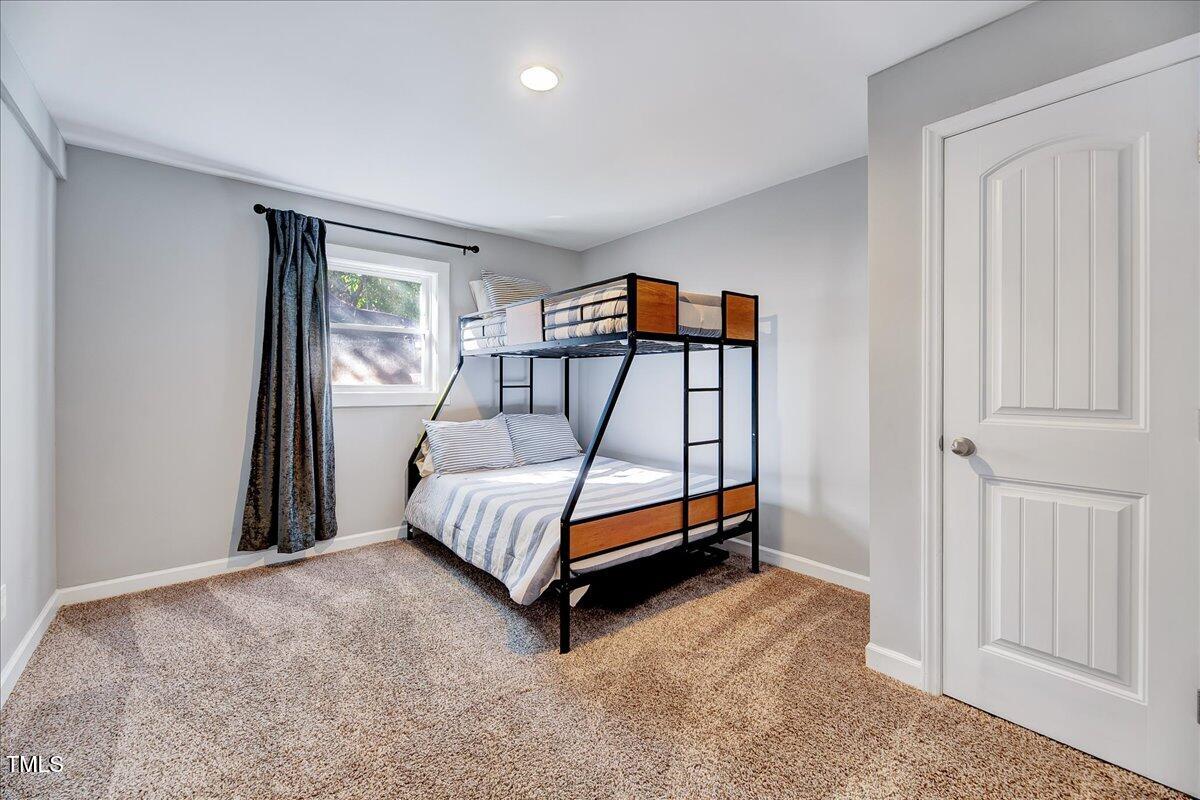 2809 Newark Drive Raleigh, NC 27610 - Photo 29 of 36 a bedroom with a bed and a window