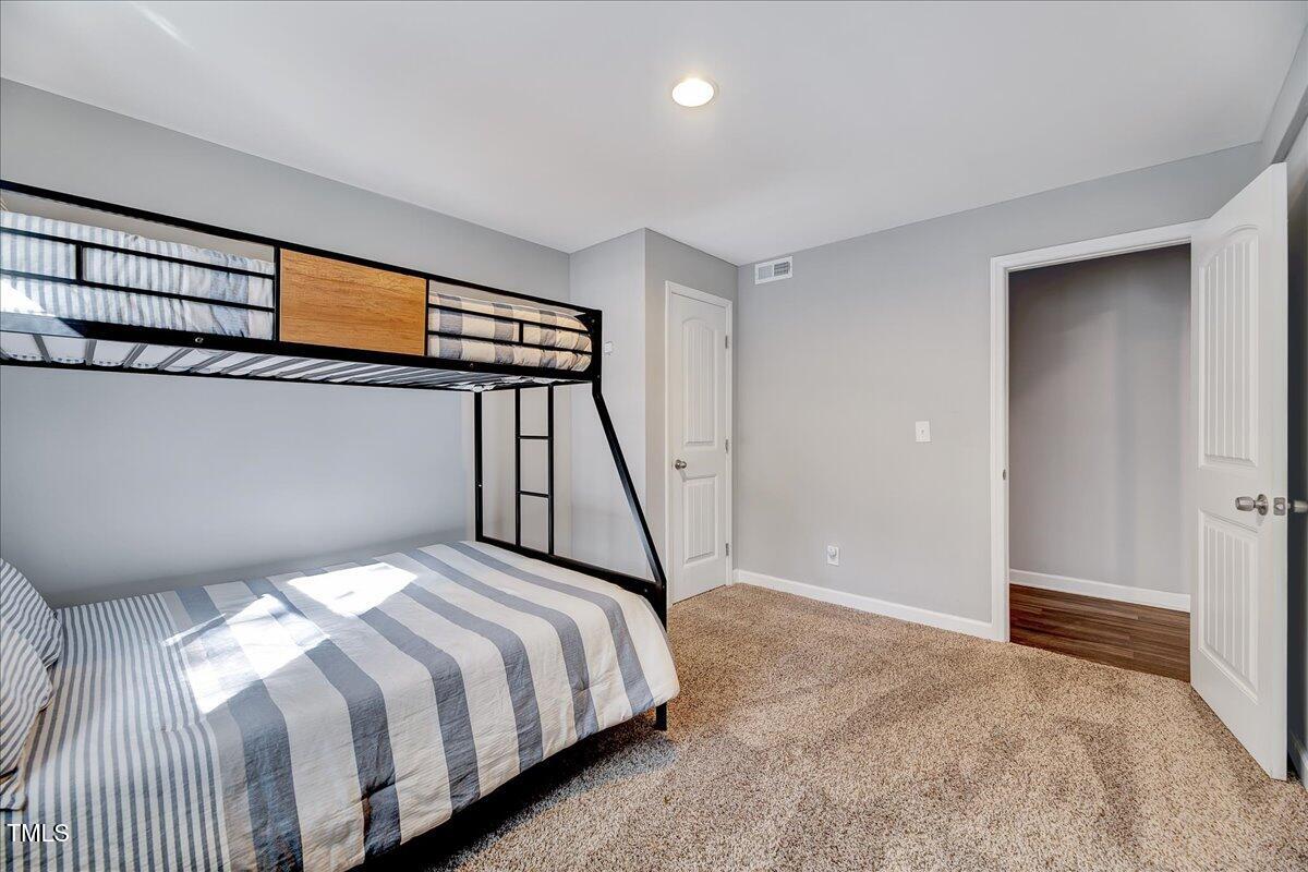 2809 Newark Drive Raleigh, NC 27610 - Photo 30 of 36 a bedroom with a bed and a window