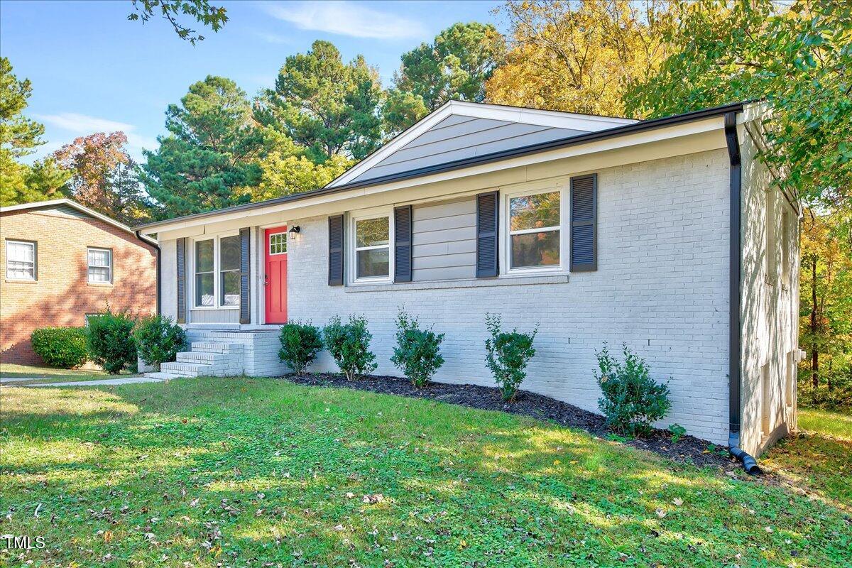 2809 Newark Drive Raleigh, NC 27610 - Photo 3 of 36 a front view of a house with garden