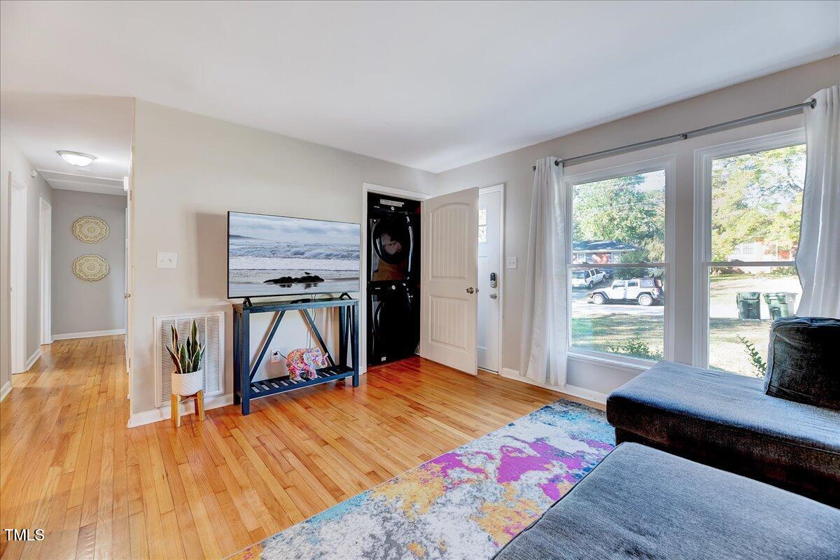 2809 Newark Drive Raleigh, NC 27610 - Photo 7 of 36 a bedroom with a bed and wooden floor