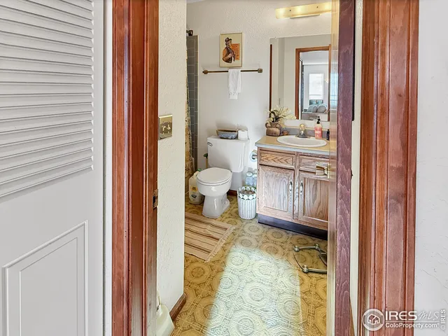 a bathroom with a sink a mirror and a shower