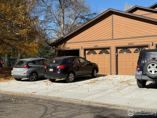 a view of a car parked in front of a house