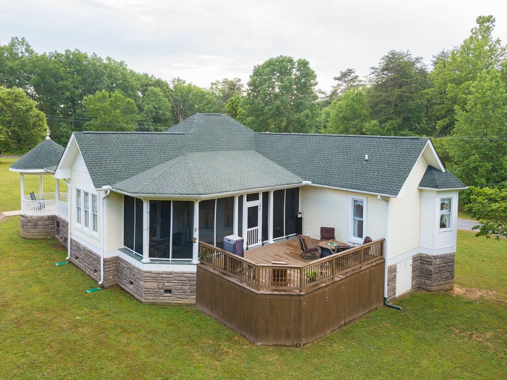 909 Williamson County Line Road Fairview, TN 37062 - Photo 12 of 66 a front view of house with yard and trees in the background