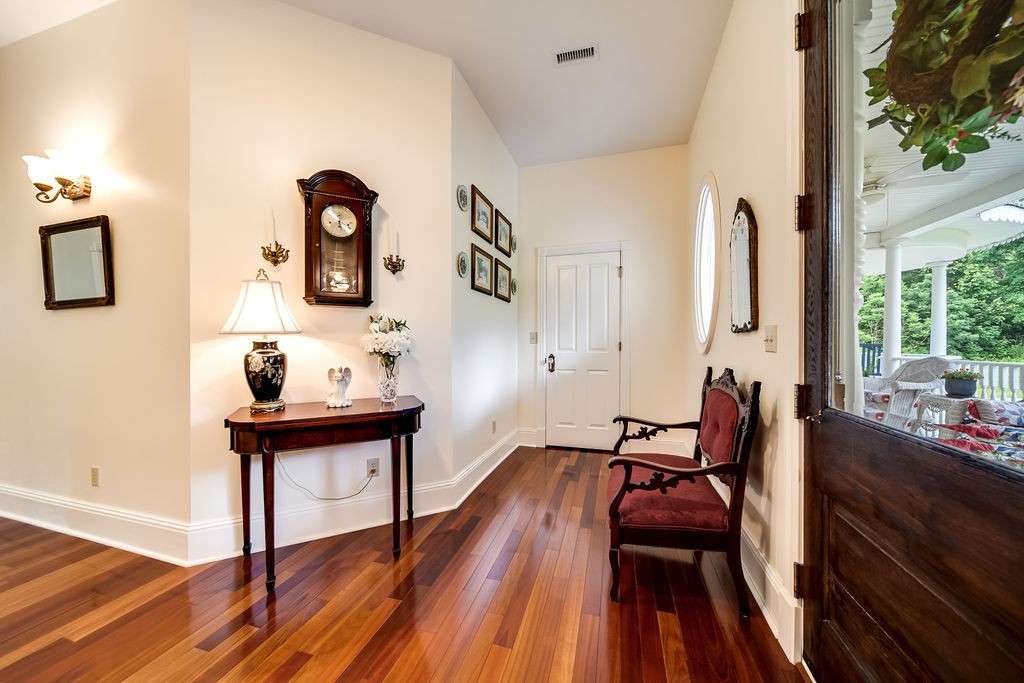 909 Williamson County Line Road Fairview, TN 37062 - Photo 22 of 66 a view of a dining room with furniture and wooden floor