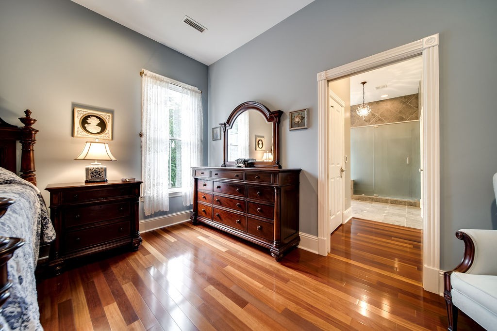 909 Williamson County Line Road Fairview, TN 37062 - Photo 26 of 66 a bedroom with a bed and a dresser
