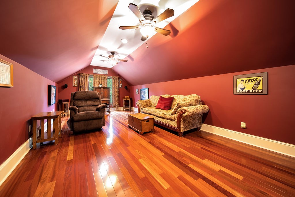 909 Williamson County Line Road Fairview, TN 37062 - Photo 31 of 66 a living room with furniture and a wooden floor