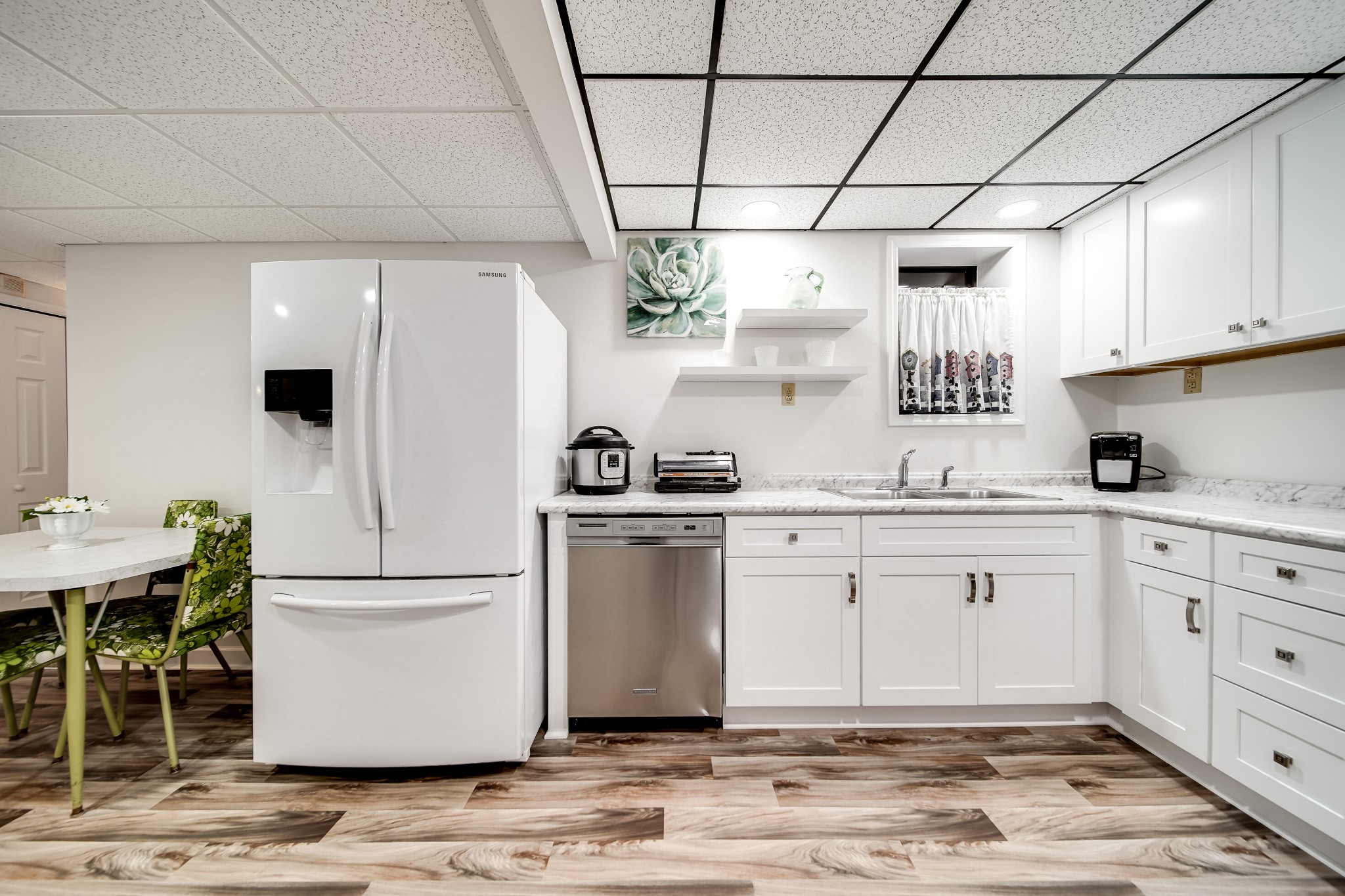 909 Williamson County Line Road Fairview, TN 37062 - Photo 47 of 66 a kitchen with a white cabinets and white appliances