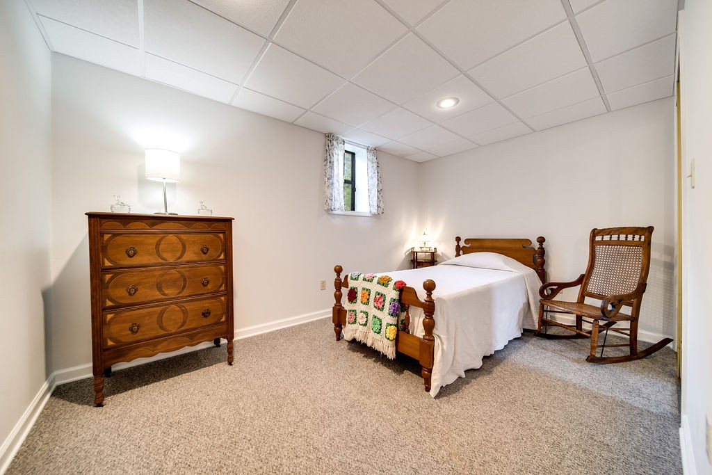 909 Williamson County Line Road Fairview, TN 37062 - Photo 51 of 66 a bedroom with a bed and cabinets