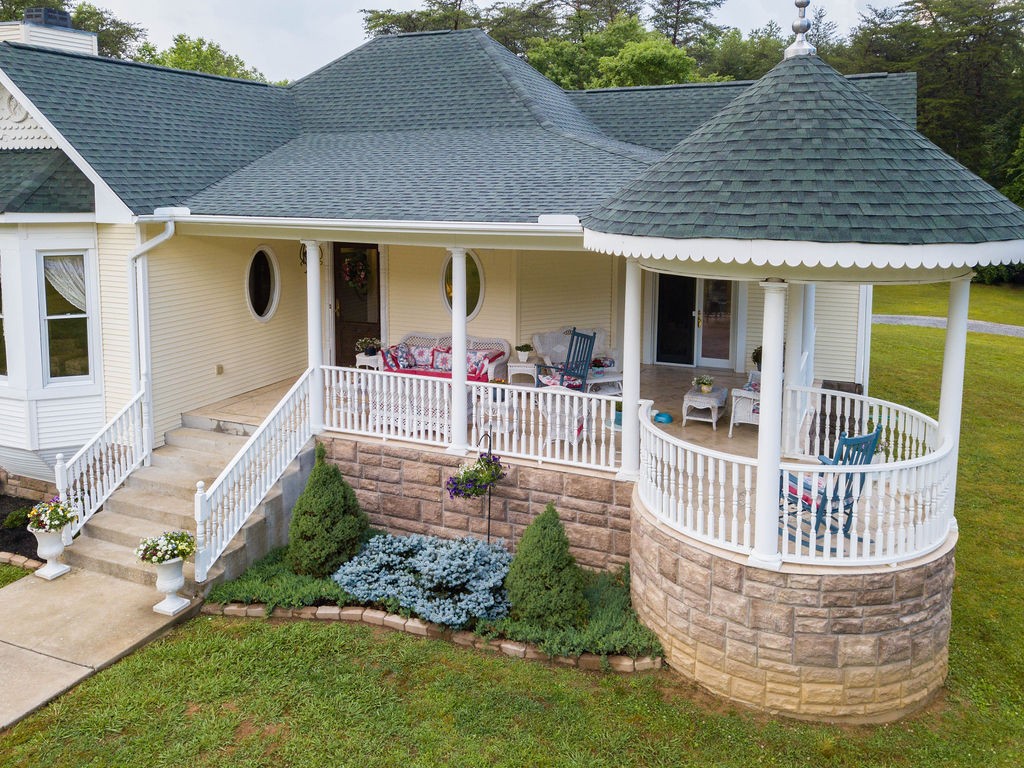 909 Williamson County Line Road Fairview, TN 37062 - Photo 7 of 66 a front view of house with yard outdoor seating and barbeque oven