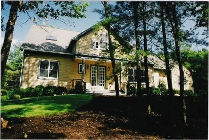 a front view of a house with garden