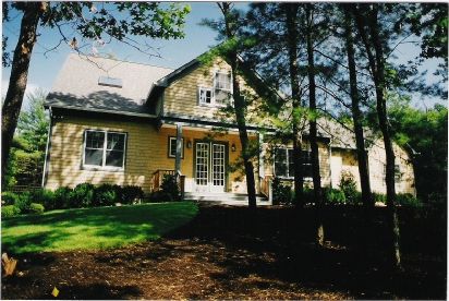 a front view of a house with garden