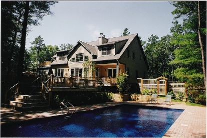 Undisclosed Address East Hampton, NY 11937 - Photo 2 of 12 a front view of a house with swimming pool