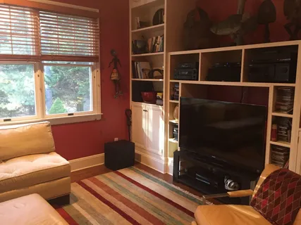 a living room with a couch and a flat screen tv