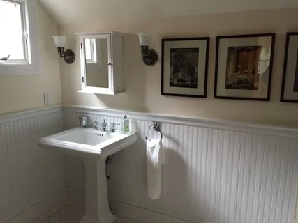 a bathroom with a sink and mirror