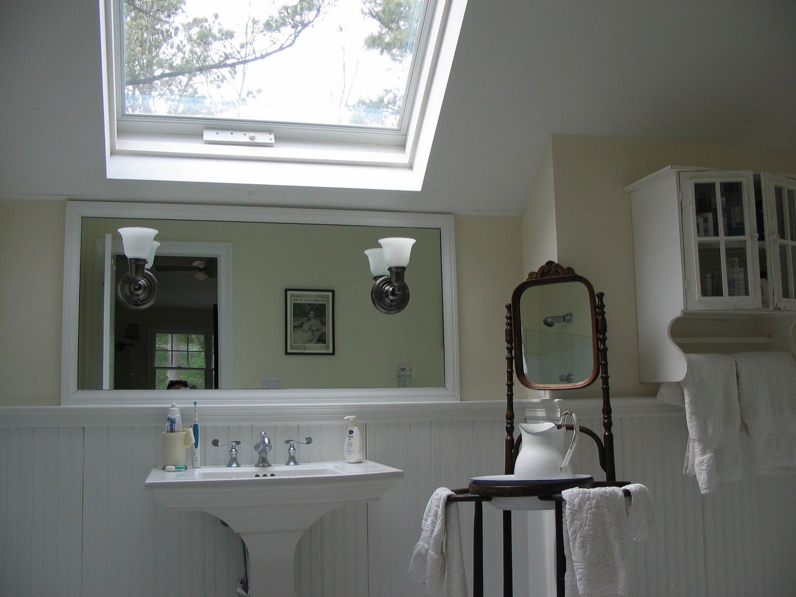 Undisclosed Address East Hampton, NY 11937 - Photo 9 of 12 a bathroom with a sink and a mirror