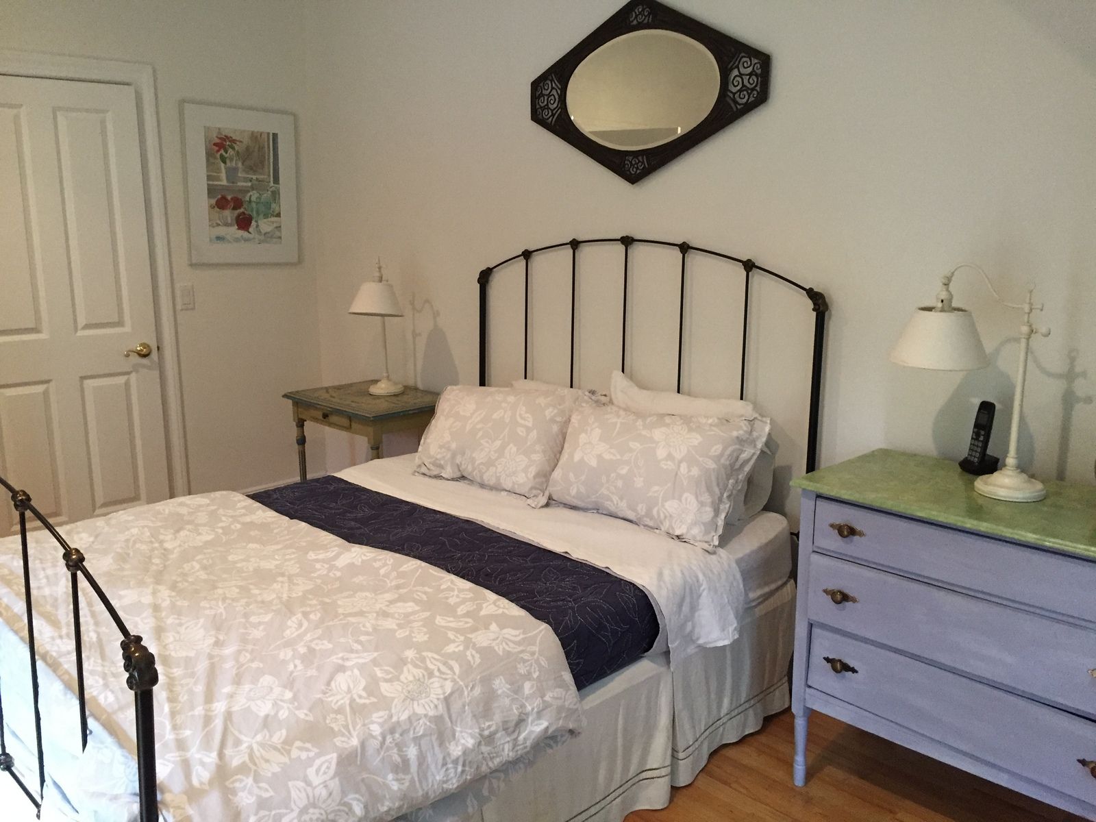 Undisclosed Address East Hampton, NY 11937 - Photo 10 of 12 a bedroom with a bed and a chandelier