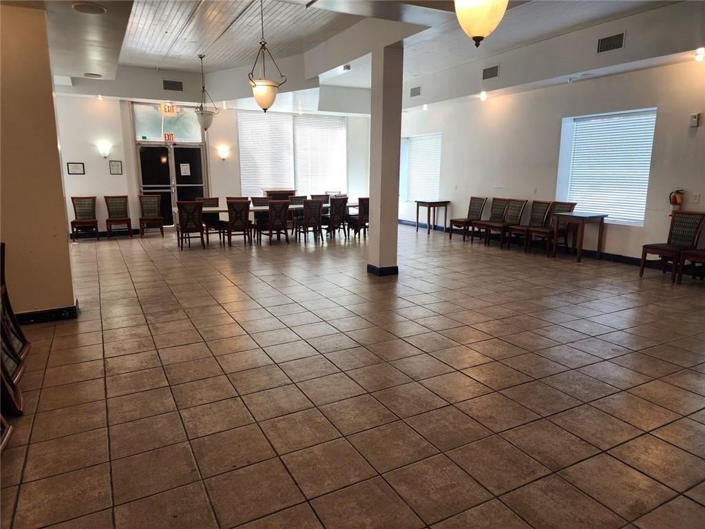 6958 Main Street Lithonia, GA 30058 - Photo 11 of 55 a lobby with furniture and a large window