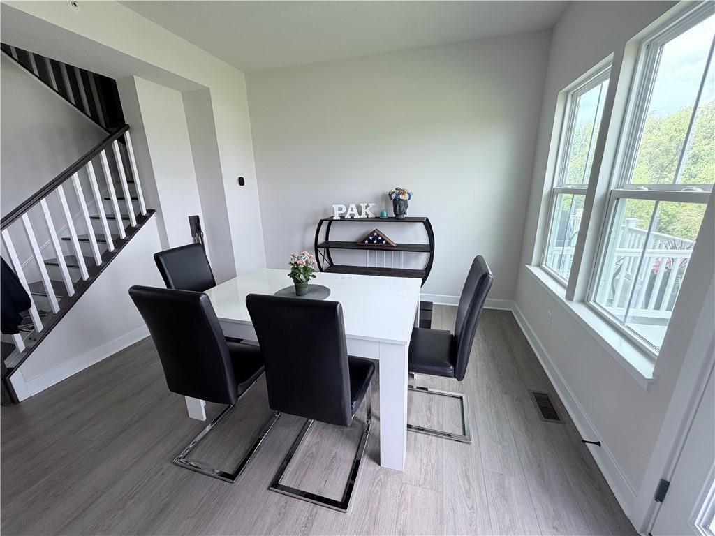 120 Crown Street McKees Rocks, PA 15136 - Photo 9 of 28 a view of a dining room with furniture window and wooden floor
