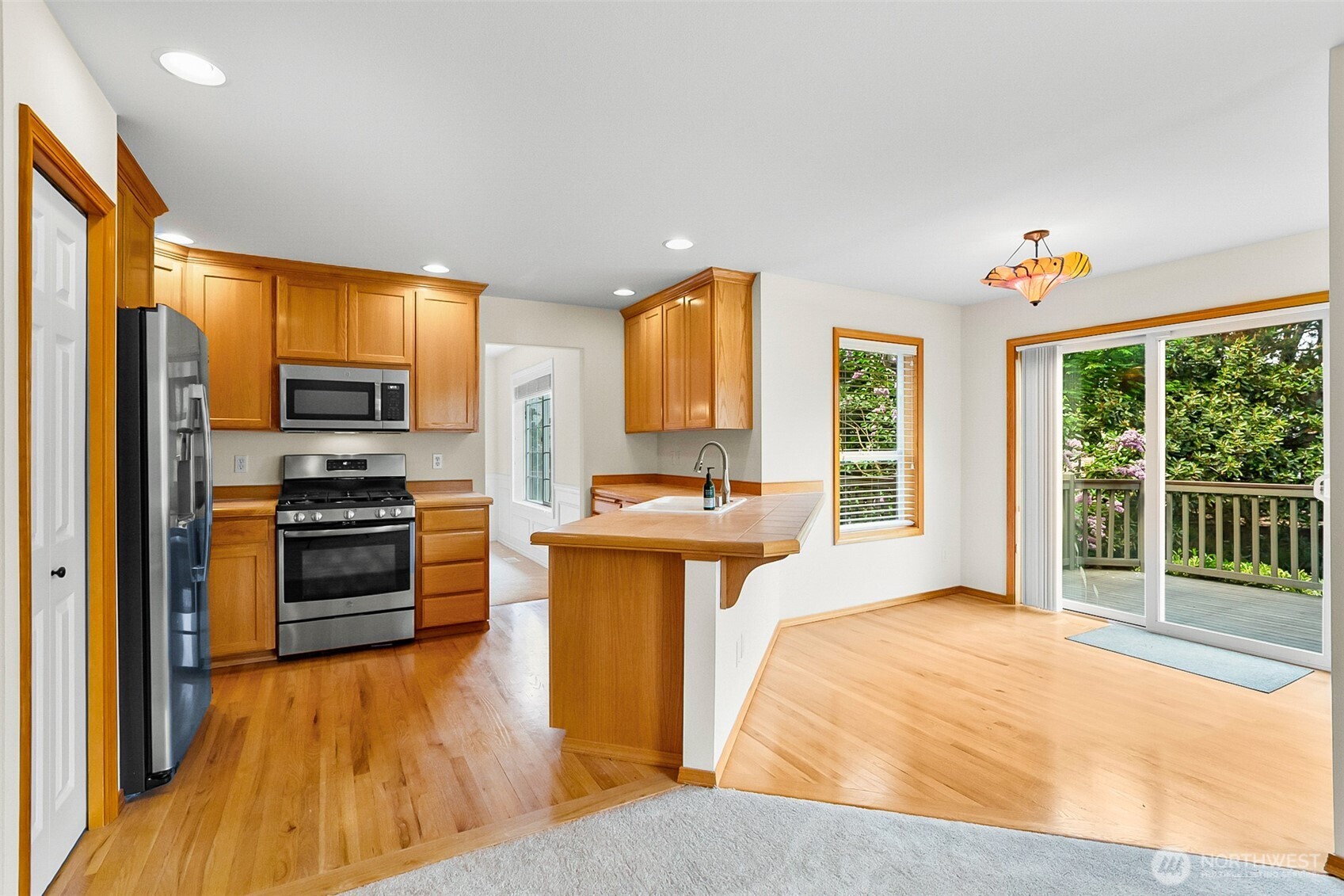 18410 11th Drive Southeast Bothell, WA 98012 - Photo 18 of 40 a spacious bedroom with a bed and wooden floor