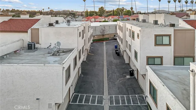 an aerial view of residential houses and trees