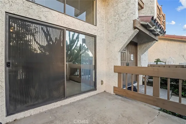 a view of balcony with furniture