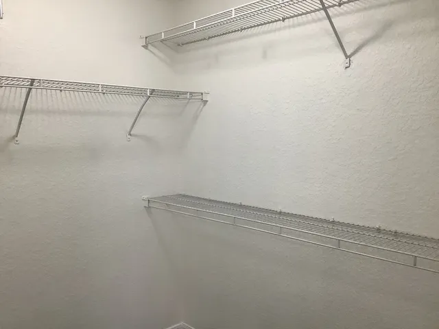 a view of a room with racks on the wall