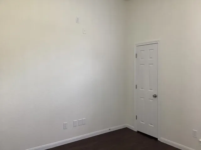 an empty room with a bench