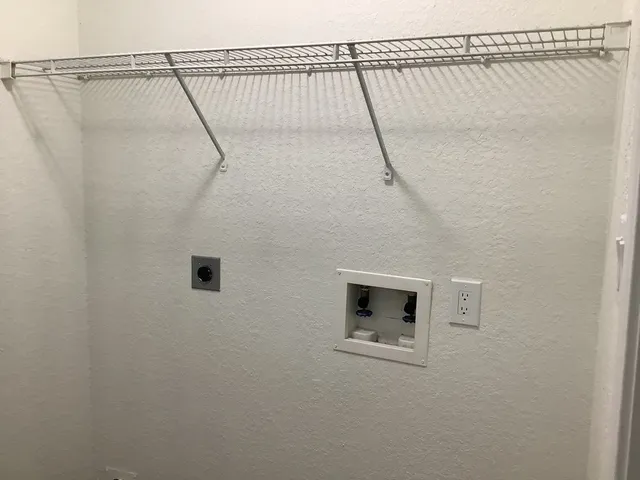 a white bath tub sitting next to a shower