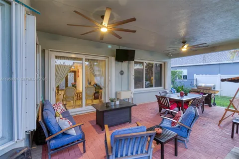 a view of a dining room with furniture and a window
