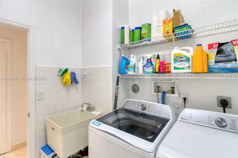 a bathroom with a tub sink and shower
