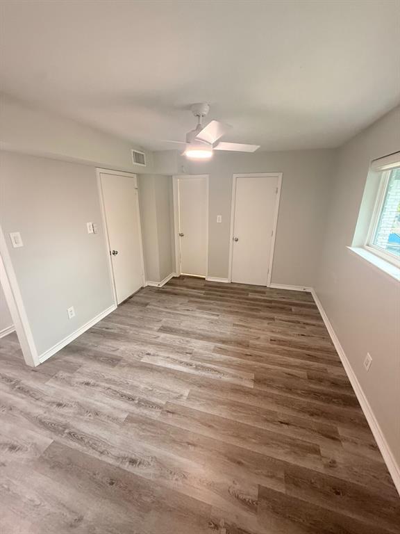 3933 Inwood Road, Unit 2025 Dallas, TX 75209 - Photo 14 of 26 a view of empty room with wooden floor