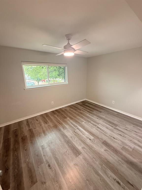 3933 Inwood Road, Unit 2025 Dallas, TX 75209 - Photo 15 of 26 wooden floor in an empty room