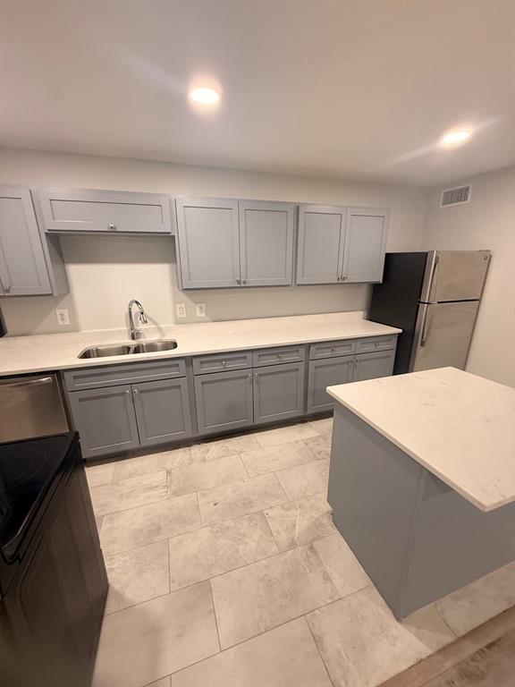 3933 Inwood Road, Unit 2025 Dallas, TX 75209 - Photo 5 of 26 a kitchen with granite countertop a sink a stove and a refrigerator