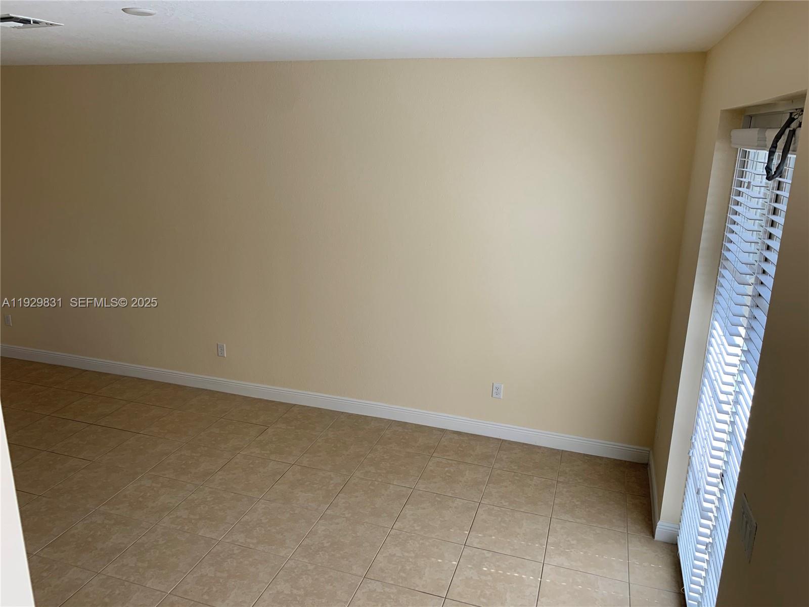 1044 Southwest 147th Avenue, Unit 10105 Pembroke Pines, FL 33027 - Photo 6 of 23 a view of an empty room