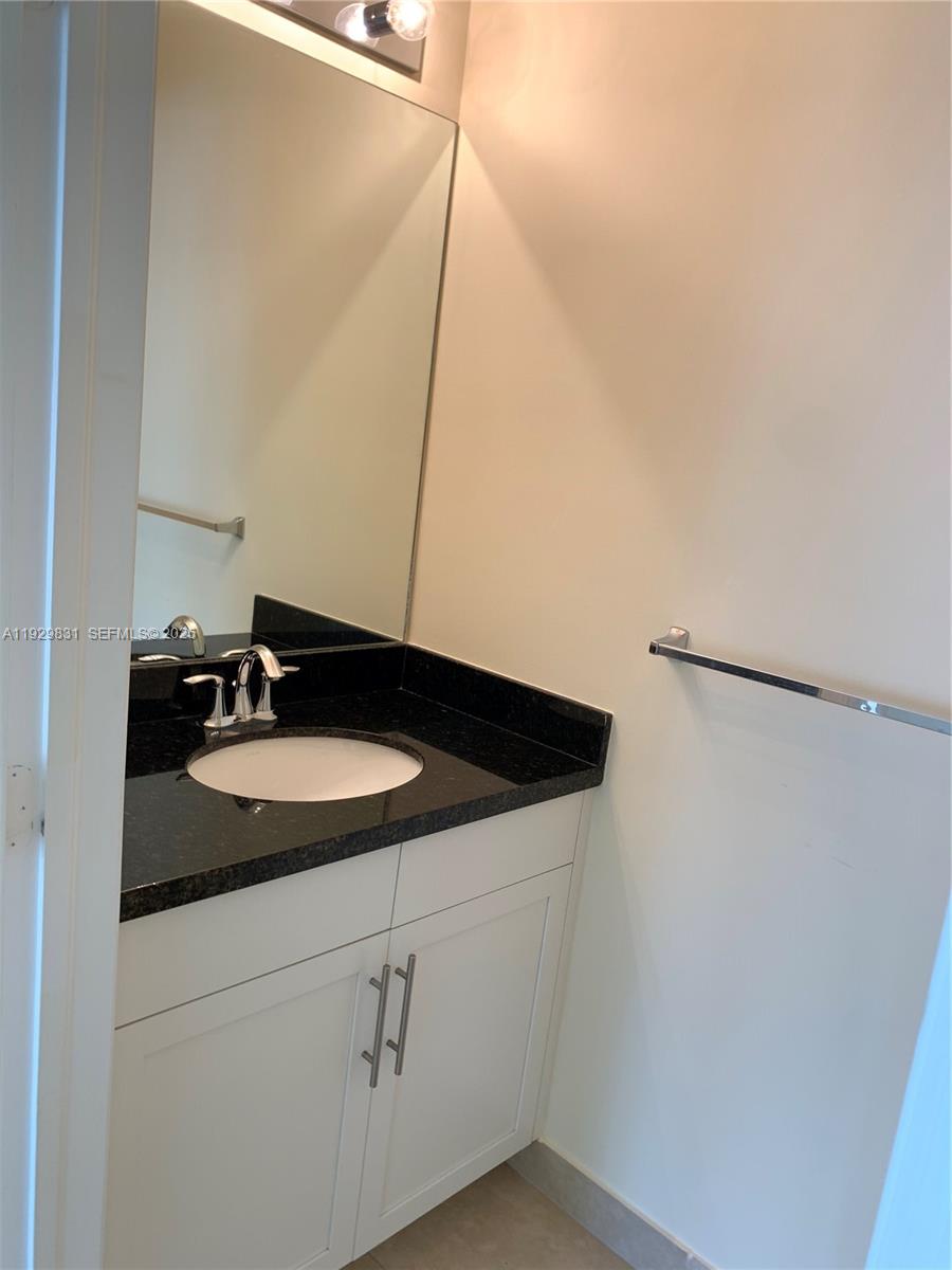1044 Southwest 147th Avenue, Unit 10105 Pembroke Pines, FL 33027 - Photo 8 of 23 a close view of sink and mirror