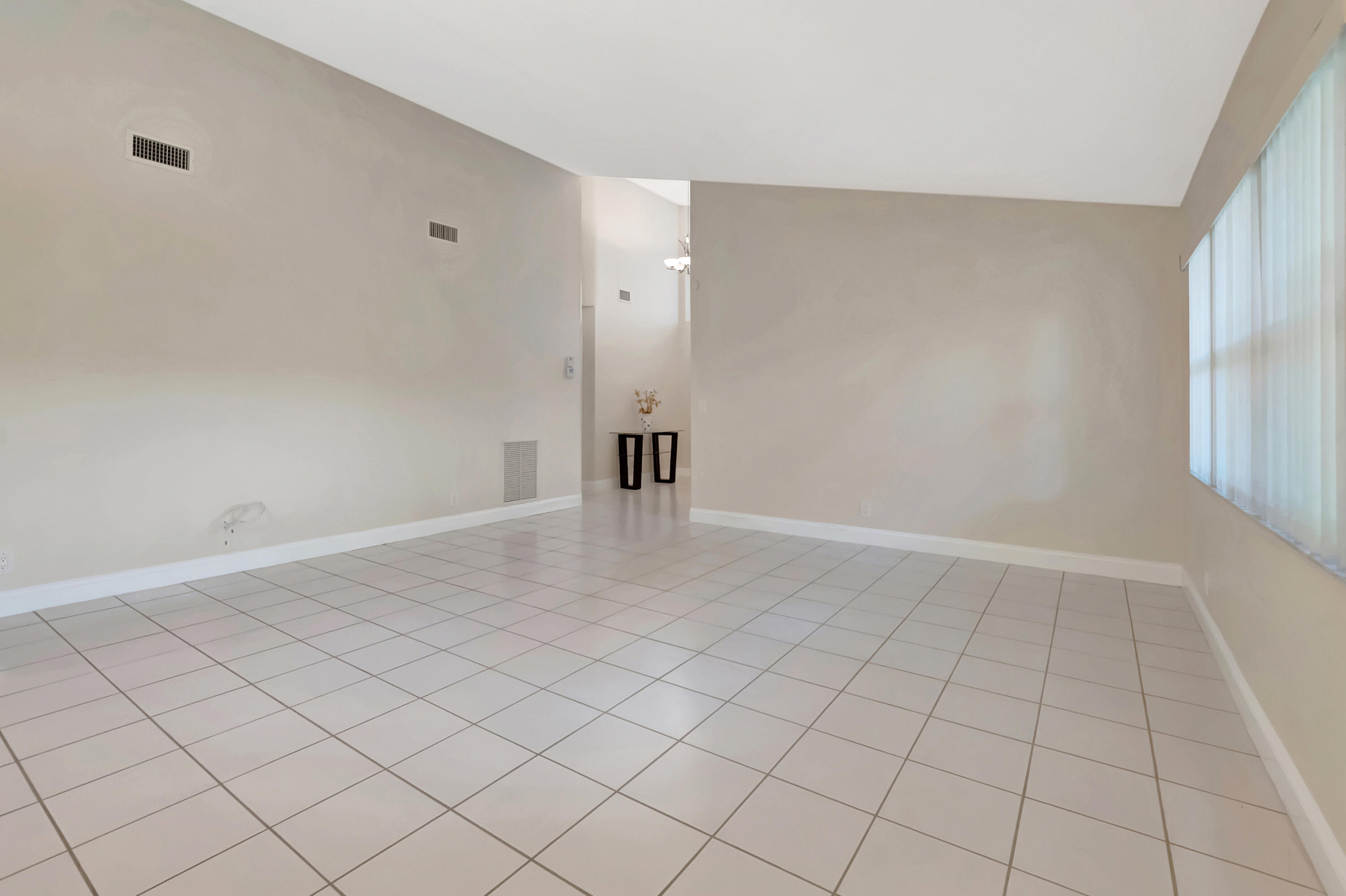 11128 Rios Road Boca Raton, FL 33498 - Photo 11 of 45 a view of an empty room and window