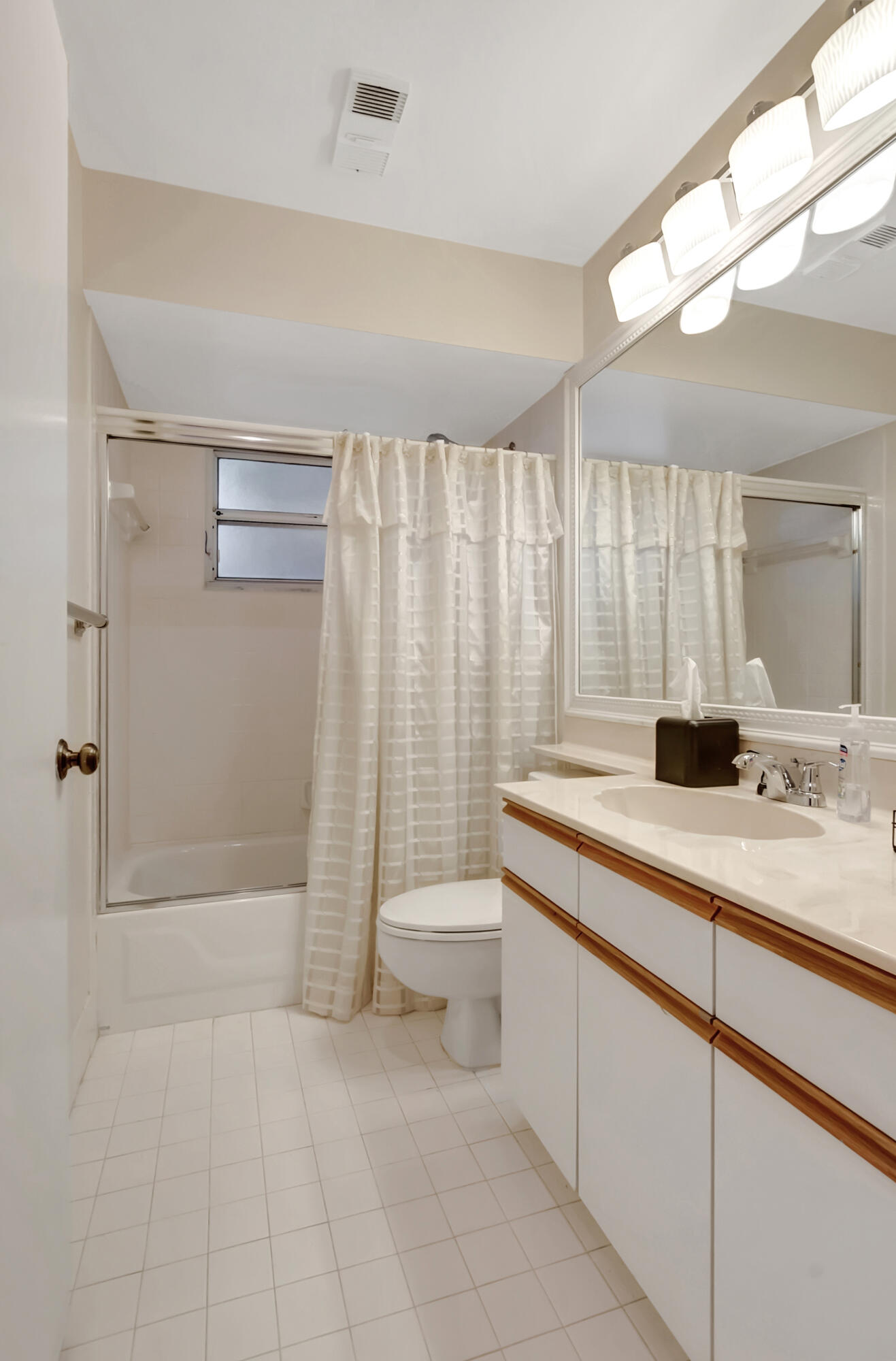 11128 Rios Road Boca Raton, FL 33498 - Photo 29 of 45 a bathroom with a double vanity sink toilet and shower