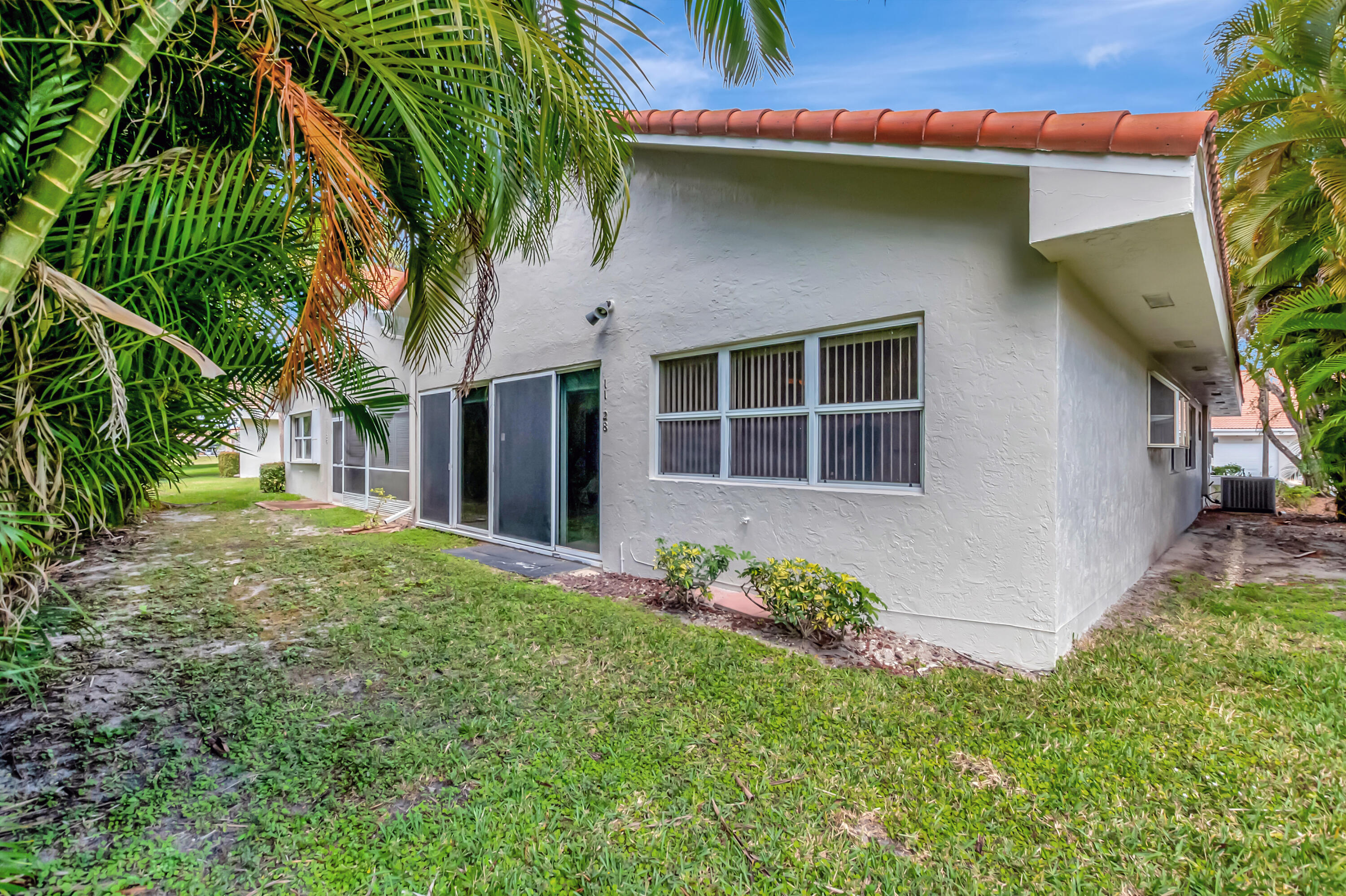 11128 Rios Road Boca Raton, FL 33498 - Photo 35 of 45 a house with trees in front of it