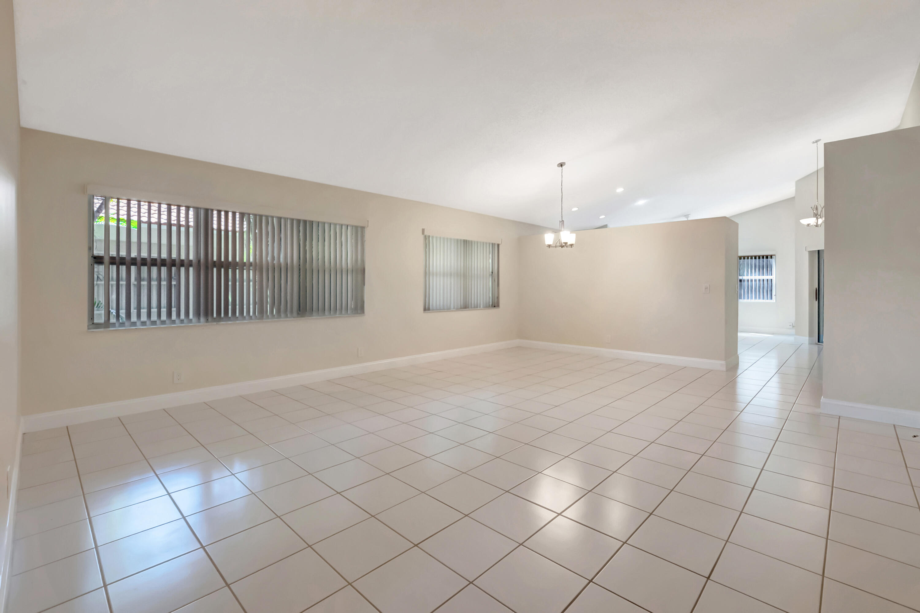 11128 Rios Road Boca Raton, FL 33498 - Photo 9 of 45 a view of an empty room with a window