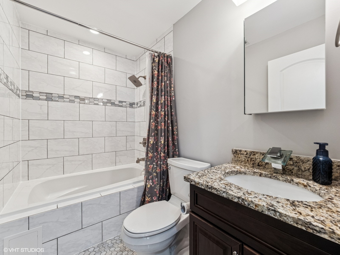 651 Garth Road Wheeling, IL 60090 - Photo 15 of 24 a bathroom with a granite countertop sink a toilet and shower