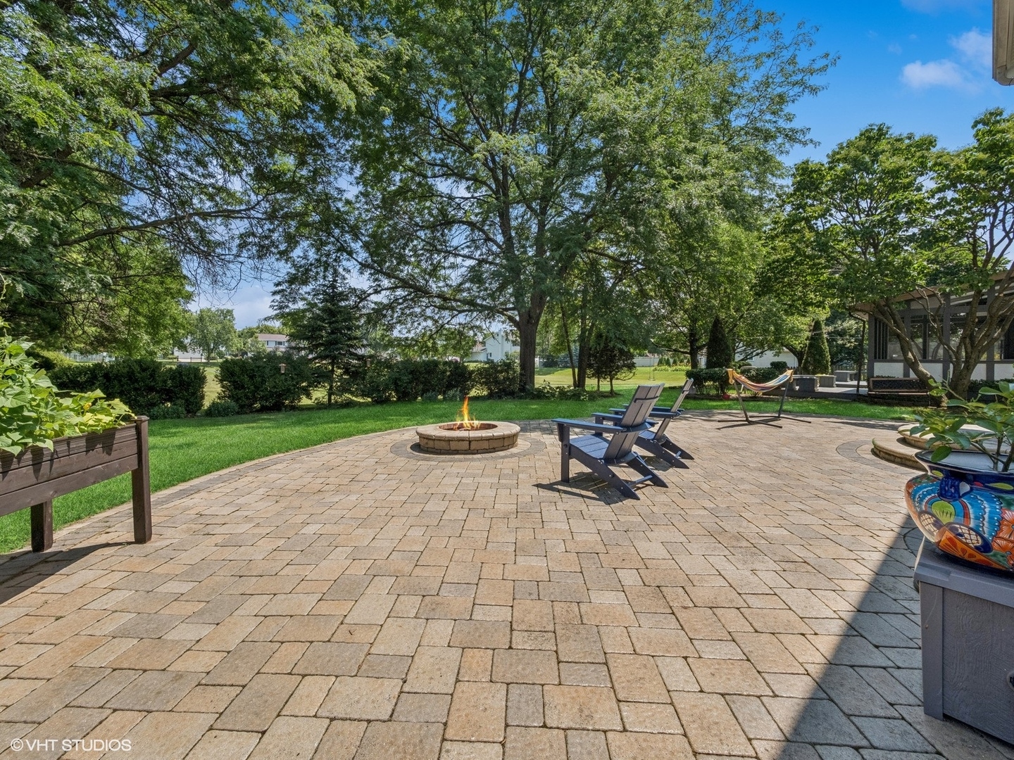 651 Garth Road Wheeling, IL 60090 - Photo 19 of 24 a view of a park with swings and slides
