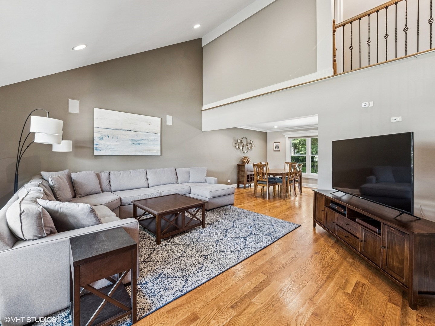 651 Garth Road Wheeling, IL 60090 - Photo 2 of 24 a living room with furniture and a flat screen tv